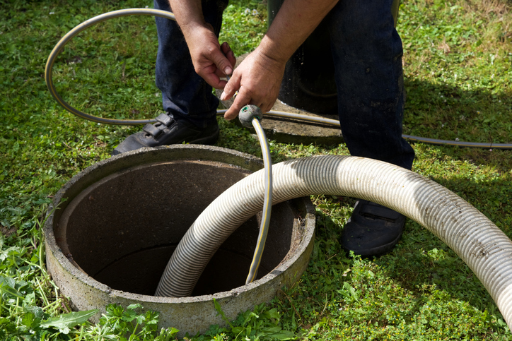Man scoping out septic tank with camera-1307039910 Man scoping out septic tank with camera